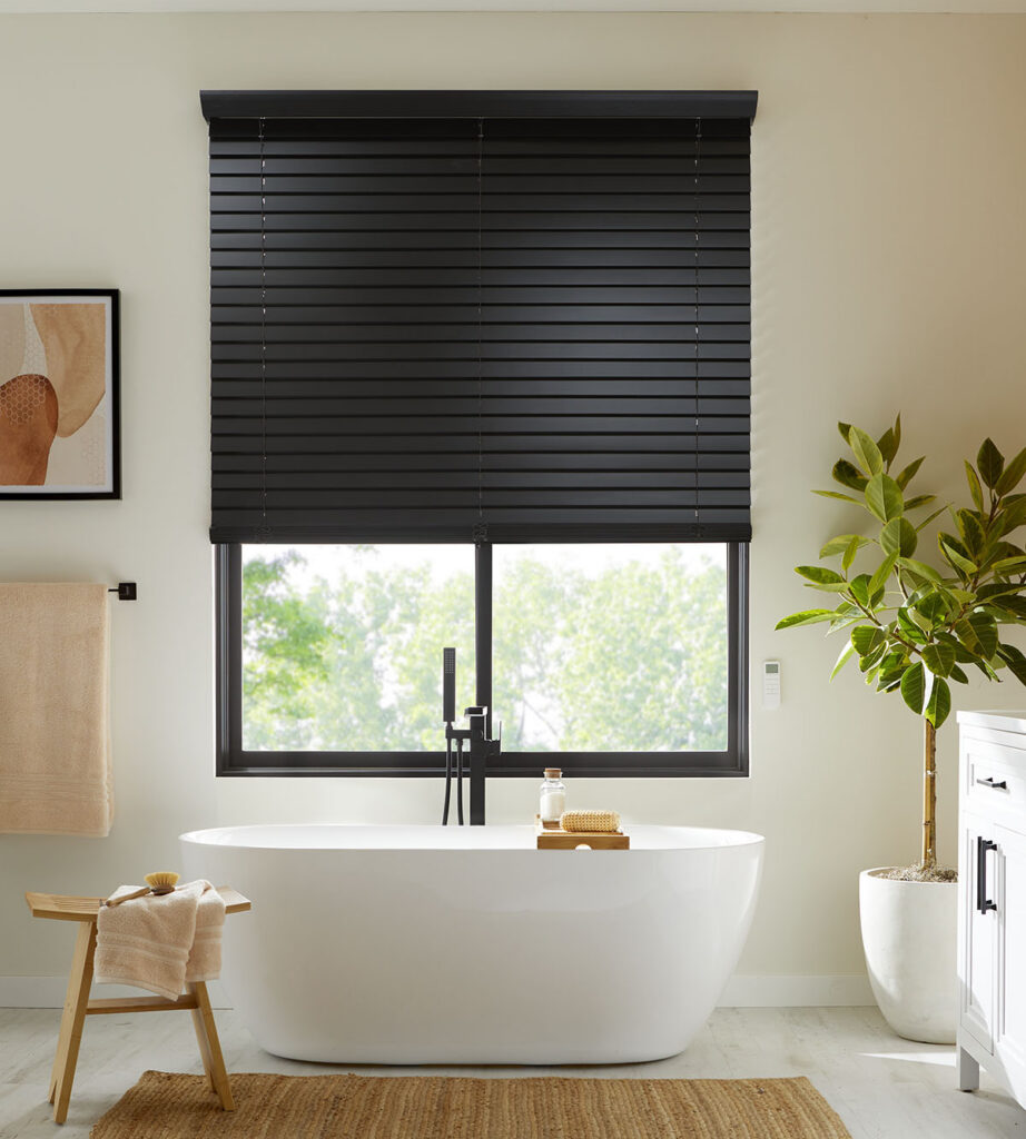 Bathroom with a black window shade