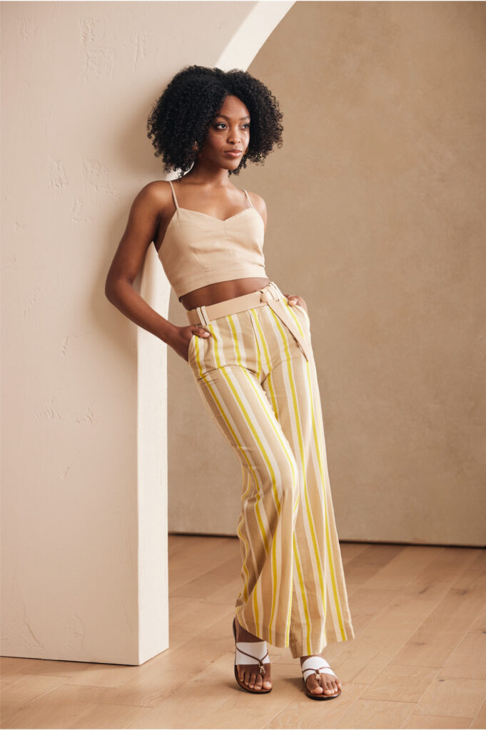Woman wearing yellow pants and a top