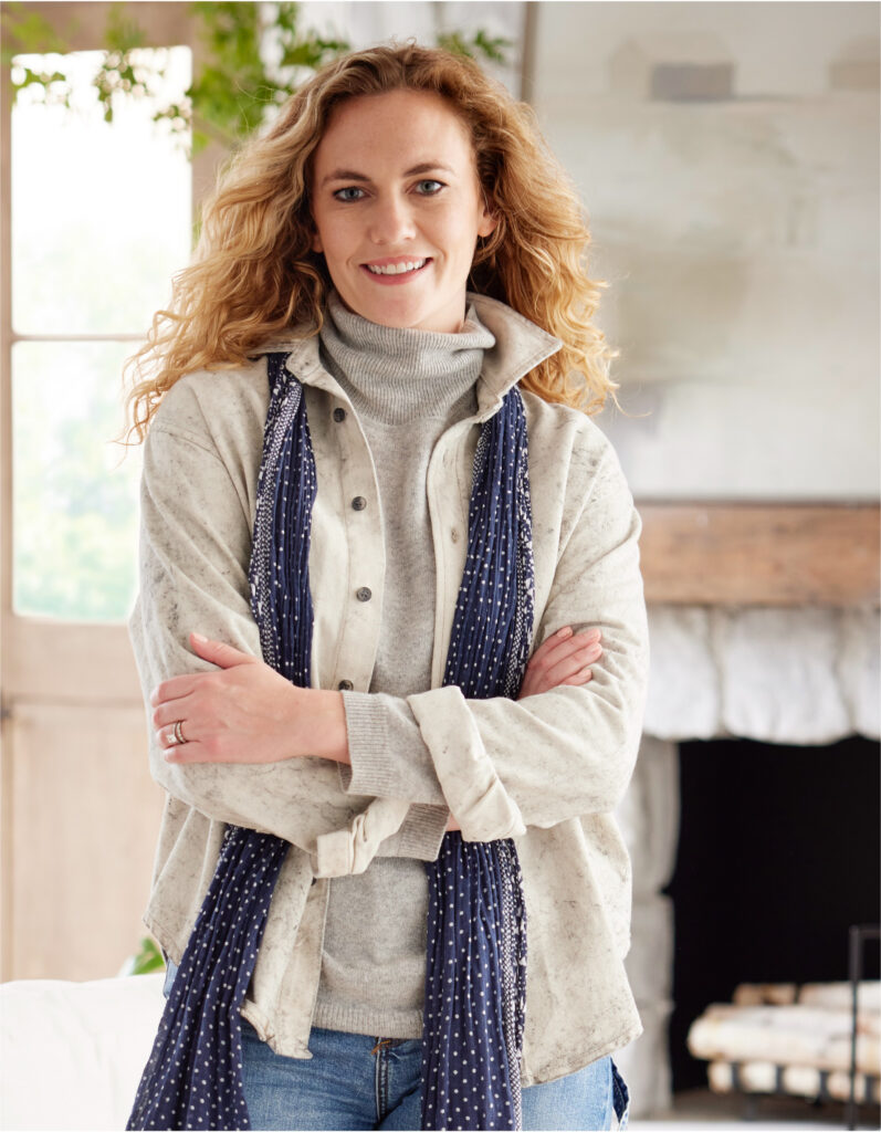 Woman wearing a scarf and sweater