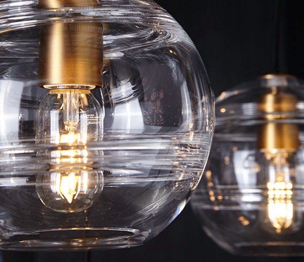 Close-up of glass globe pendant lights