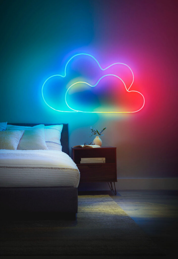 Bedroom with colorful neon cloud light art