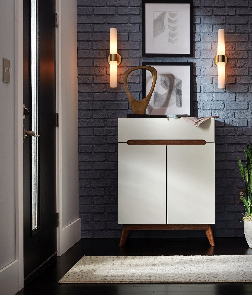 Entryway with wall sconces and a console table