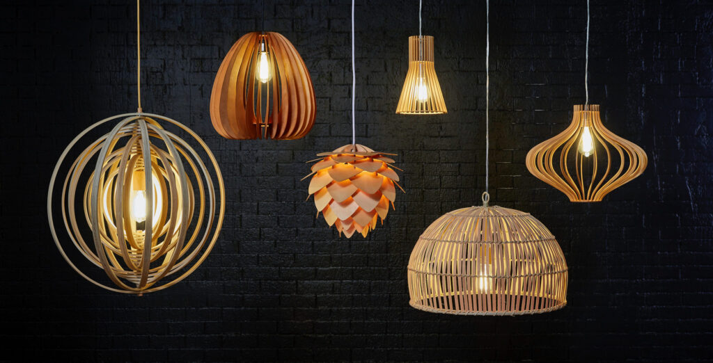 Assorted pendant lights against a dark brick wall