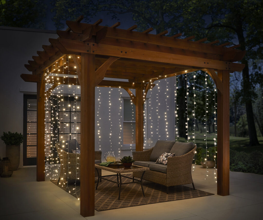 Outdoor pergola with string lights at night