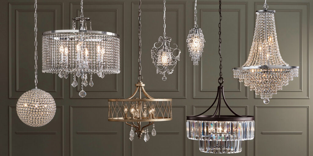 Crystal chandeliers displayed against a dark wall