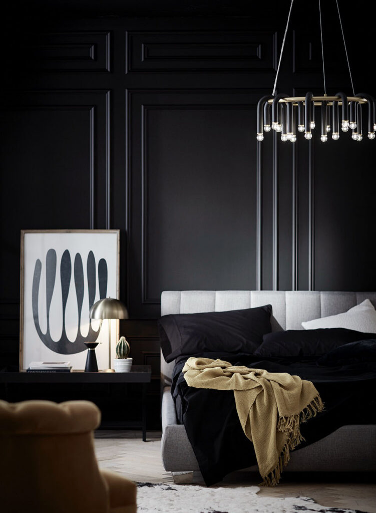 Dark bedroom with a modern pendant light