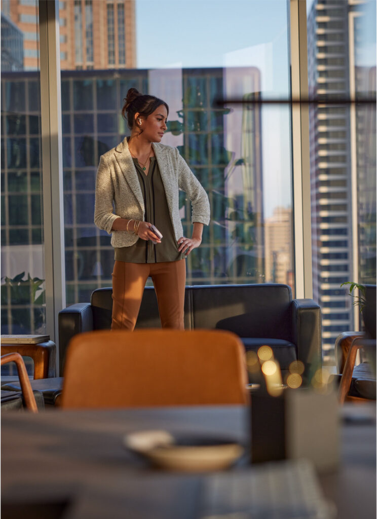 Person working in a modern office by windows