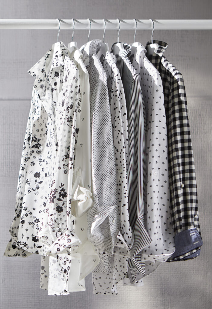 Patterned blouses hanging on a rack