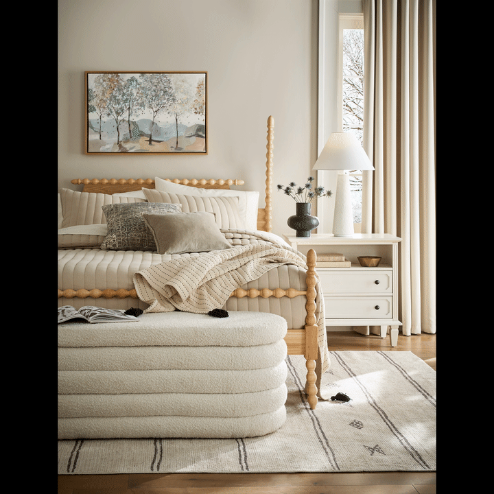Bedroom with neutral bedding and decor