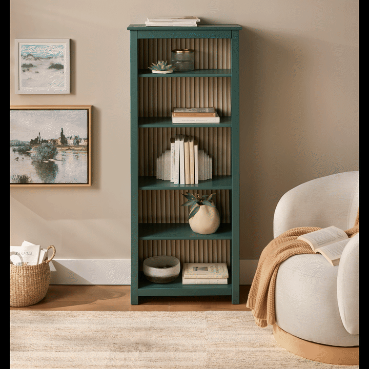 Bookshelf and chair in a styled room