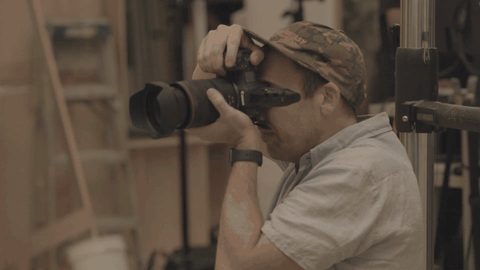 Photographer using a camera