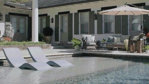 Poolside patio with lounge chairs