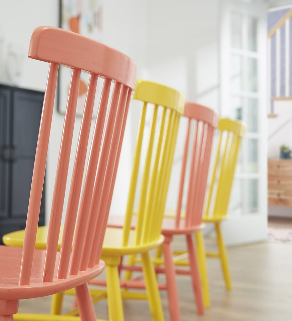 Colorful painted chairs in a room