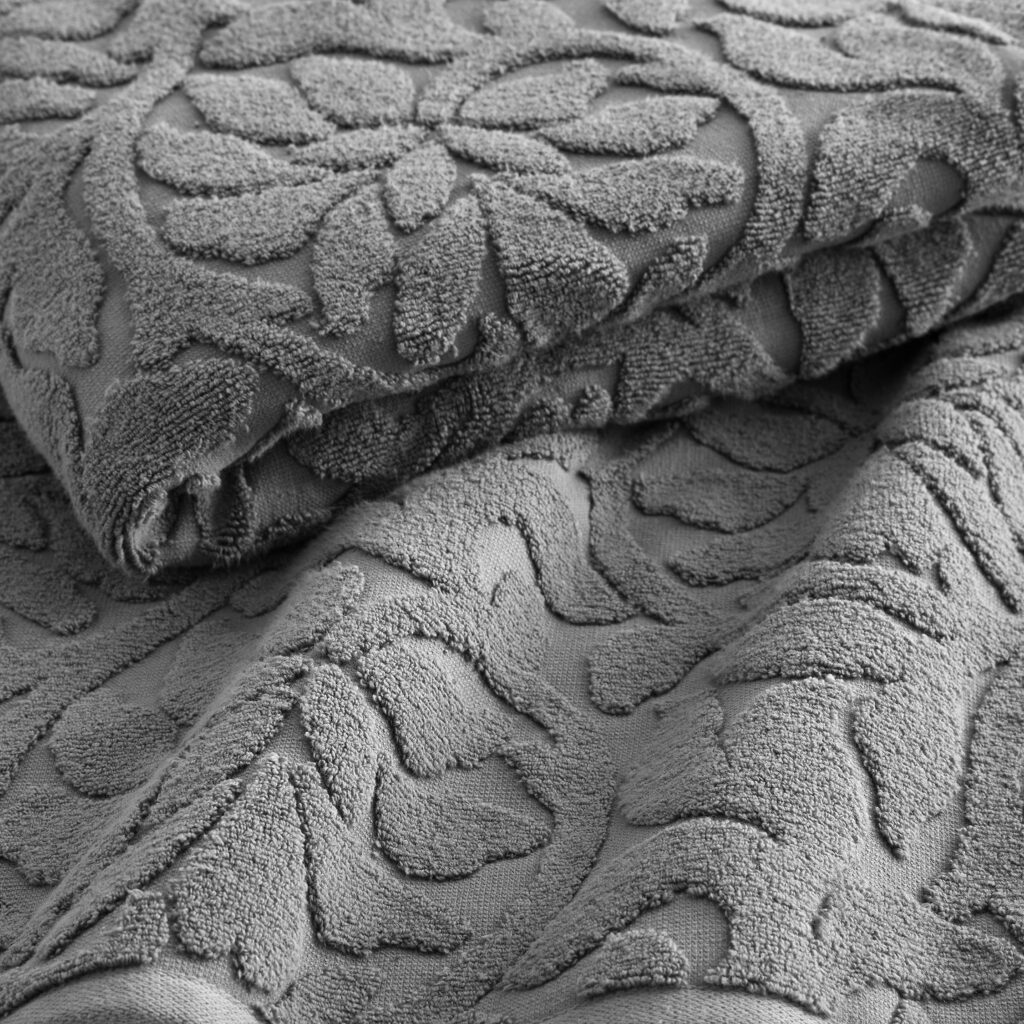 Close-up of a textured gray blanket, black and white