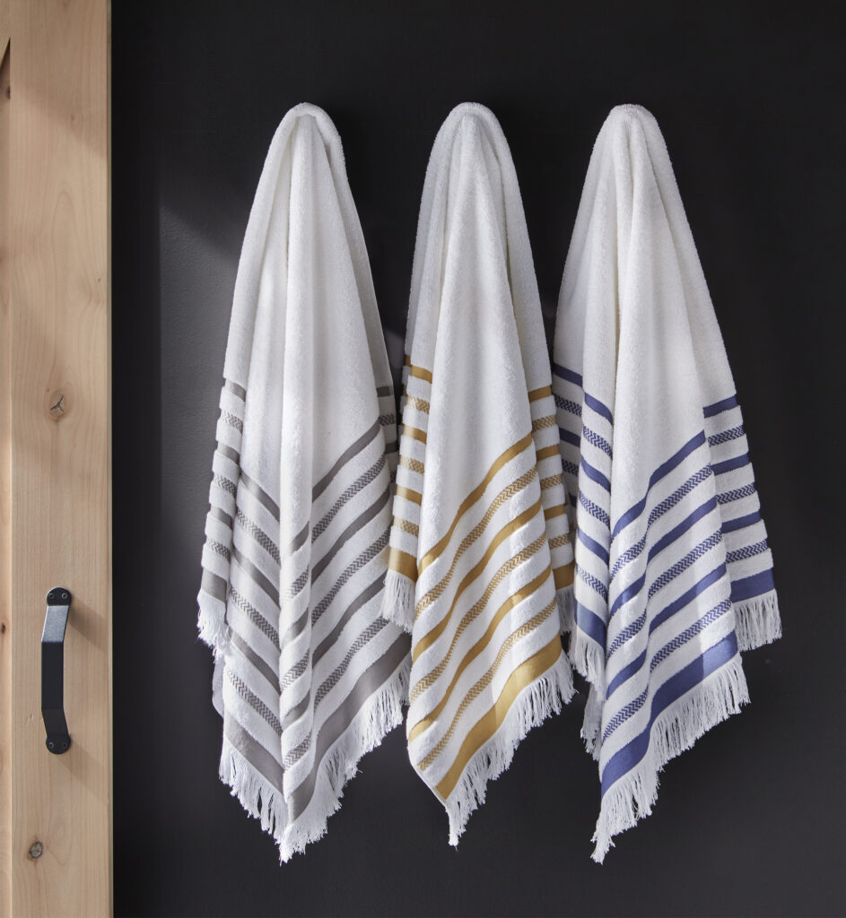 Striped towels hanging on a door