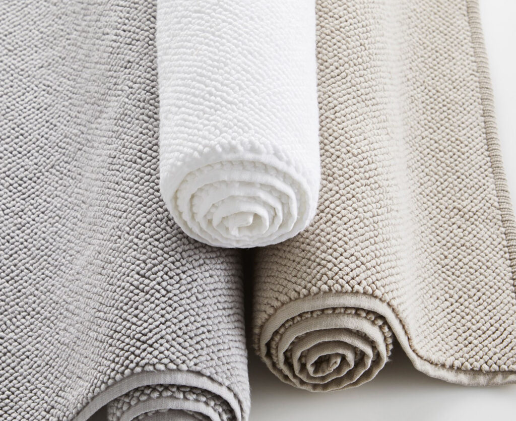 Rolled gray and beige blankets