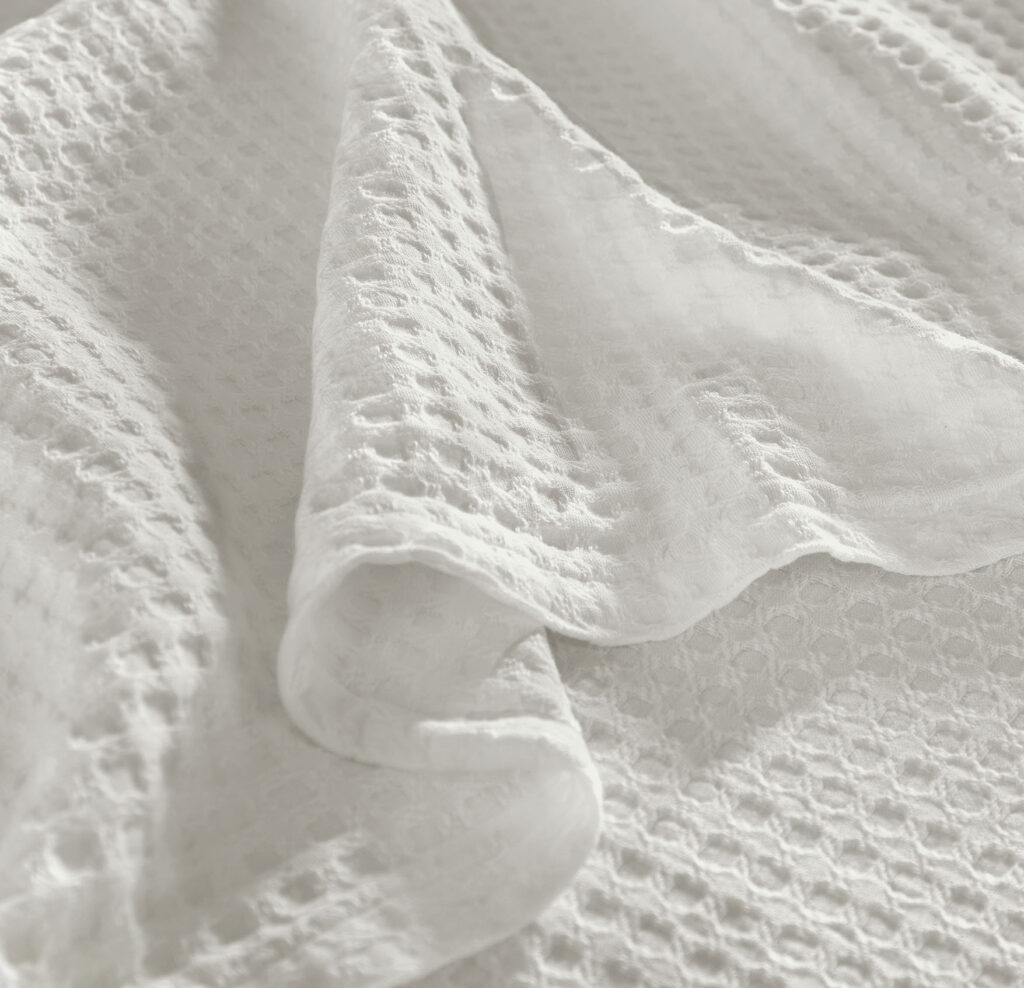 Close-up of a white textured blanket